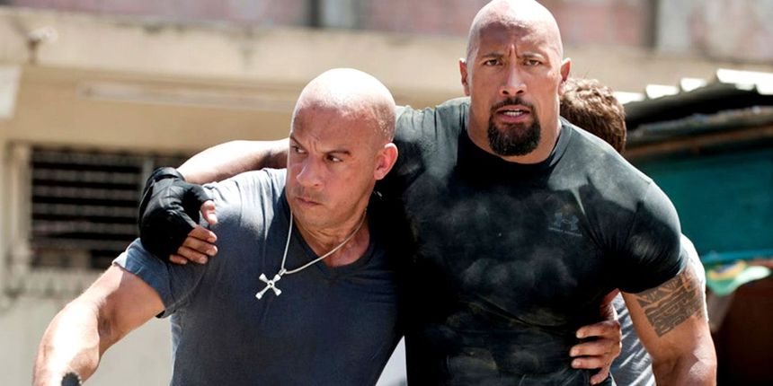 Vin Diesel's Dom carrying the wounded Hobbs (Dwayne Johnson) in Fast Five