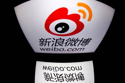 The chinese app Weibo's logo is displayed on a tablet on January 2, 2014 in Paris. AFP PHOTO / LIONEL BONAVENTURE