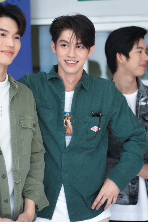 two young men standing next to each other