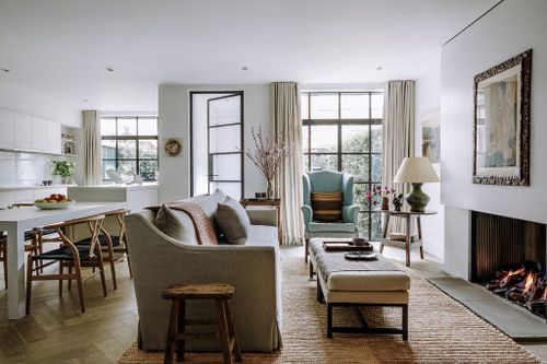 Image may contain Living Room Room Indoors Furniture Couch Interior Design Table Chair and Home Decor