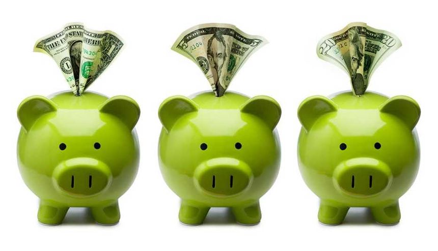 three green piggy banks with money in slots  related to simple investing strategy