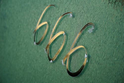 No. 666. The number three sixes on a a frost surface. of a car window, Number six hundred sixty six on a ragged metal surface. No. 666. The number three sixes in red paint on an old rusty blue surface. Number six hundred sixty six on a ragged metal surface. beast-666 stock pictures, royalty-free photos & images