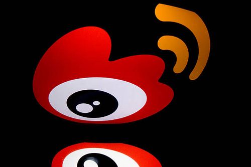 The chinese app Weibo's logo is displayed on a tablet on January 2, 2014 in Paris. AFP PHOTO / LIONEL BONAVENTURE