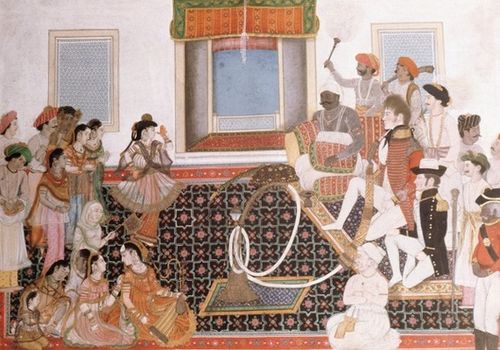 Officers of the East India Company being entertained by musicians and dancers, depicted in an Indian image from around 1820. (Werner Forman/Universal Images Group/Getty Images)