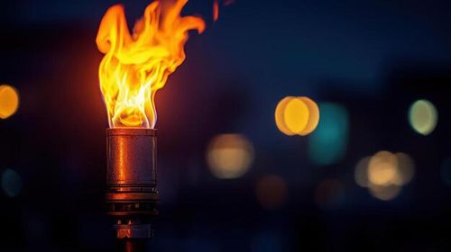 Night Flame Torchlight Illuminates Urban Bokeh photo
