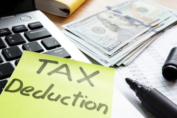 Tax deduction written on a memo stick. Tax deduction written on a memo stick. tax deductions stock pictures, royalty-free photos & images