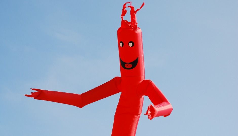 classic red tube man model on display