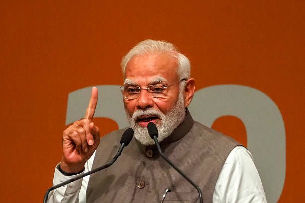 India's Prime Minister Narendra Modi addresses the gathering during an event marking 20 years of the Gujarat Urban Growth Story at Gandhinagar, in...