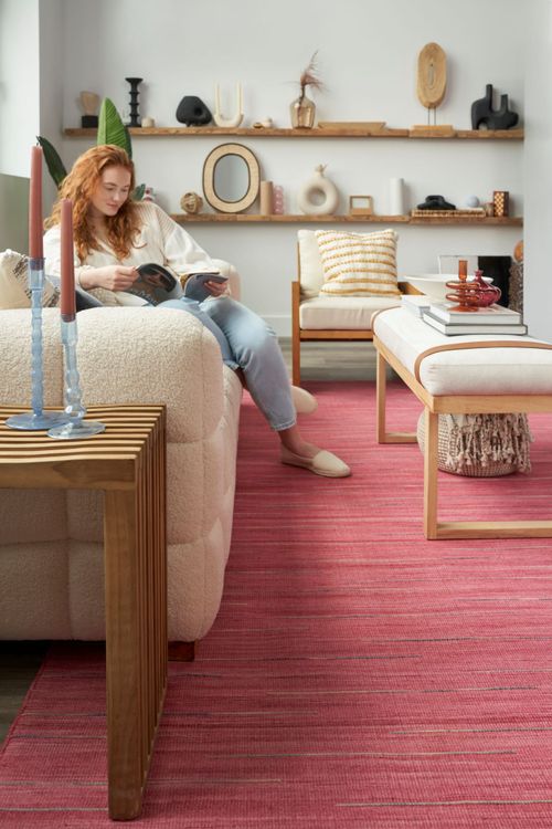 Woman reading a magazine in a retro style living room