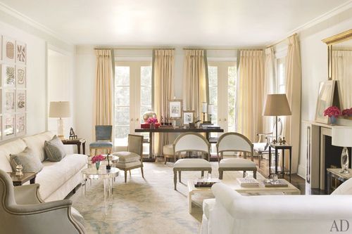 Image may contain Furniture Chair Living Room Room Indoors Interior Design Flooring Lamp Table Lamp and Couch