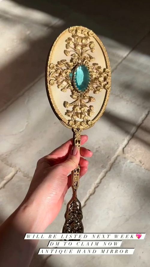 This contains an image of: @Vintagestill _Life vintage gold sapphire hand held mirror.