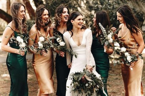 emerald green and gold bridesmaid dresses and a white wedding gown for emerald green wedding colors ideas for 2025 emerald green and gold