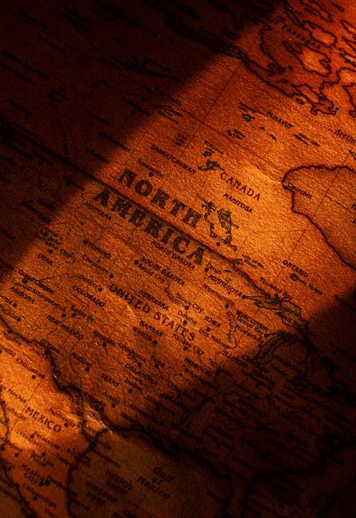 Free Close-up view of a vintage styled map showing North America with dramatic lighting. Stock Photo