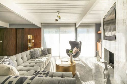 Open home with mid century modern interior design by Decorilla designer Michelle B.