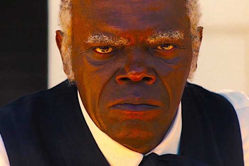 Stephen stares hatefully into the camera in a scene from Django Unchained.