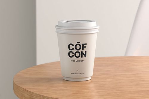 Front View of Paper Coffee Cup Mockup on Rustic Table FREE PSD