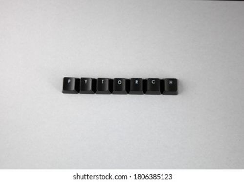 PYTORCH spelled using black keys from computer keypad, computer programming language, white background Stock Photo