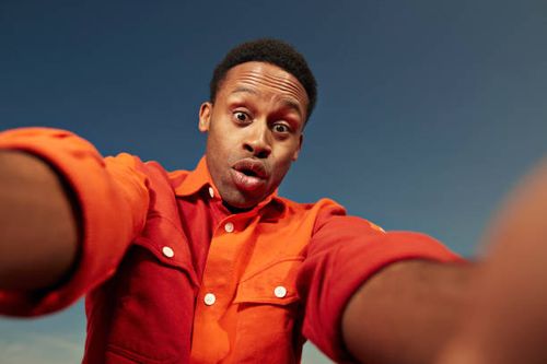 surprise young man taking selfie against sky - funny poses stock pictures, royalty-free photos & images