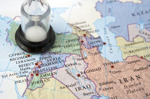 Sand watch on top of a map next to Syria and Damascus. Also in the photo Iran, Iraq, Jordan and Israel. Israel iran map stock images, royalty-free photos and pictures