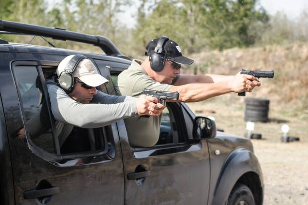 Military tactical car shooting. Army soldiers in action Military tactical car shooting. Army soldiers in action. Outdoor shooting range gun shot car stock pictures, royalty-free photos & images