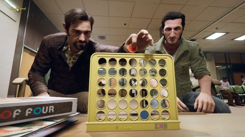 Two men playing Connect 4 in the co-op game, A Way Out.