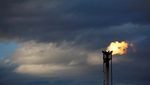 arafed oil flares from a well in the middle of a cloudy sky