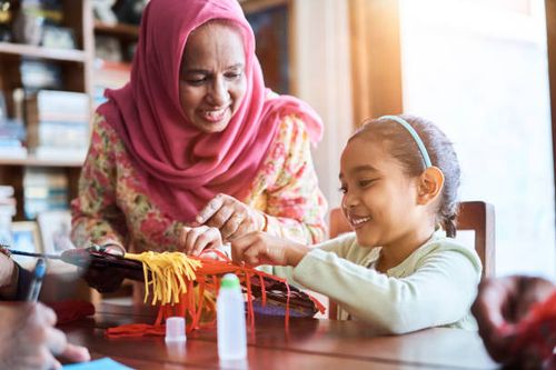 family making wau bulan at home - making wau stock pictures, royalty-free photos & images