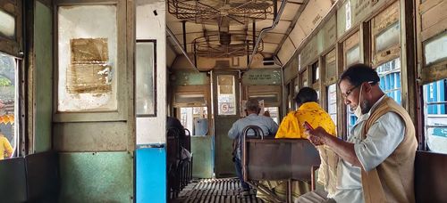 When in a tram, there’s a unique opportunity to leave the affairs of the world behind. A peek outside will unearth the busy city’s bustle but inside there is quiet tranquillity. All tramcars have a patented design — a clanky engine, large circular fans across the ceiling, windows with railings a standard five inches apart, rickety wooden seats and a grumpy conductor pulling on the string to the tram’s antique bell.