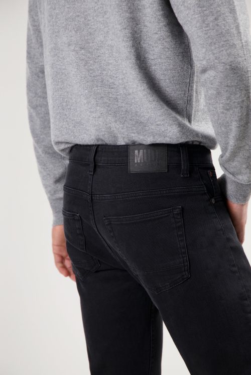 Sustainable MUD Jeans in light blue denim, crafted from eco-friendly materials, showcasing a classic straight-leg fit.