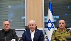 Prime Minister Benjamin Netanyahu, center, with Defense Minister Israel Katz and IDF Chief of Staff Eyal Zamir, at a briefing last week where he promised to continue 'crushing' Iran.