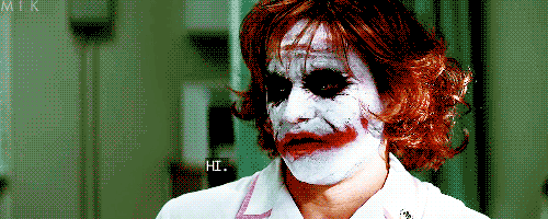 Animated GIF of the Joker from the movie The Dark Knight dressed as a nurse, with the text Hi.