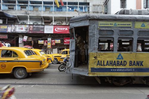 Calcutta, West Bengal, India - September 21, 2011: Electric tram used for transport in the centre of Calcutta (Kolkata), West Bengal, India. The use of electric trams in Calcutta dates back over one hundred years to the time British rule. The tram system is still in daily use and provides a vital means of moving people around the crowded city. Kolkata tram stock images, royalty-free photos and pictures