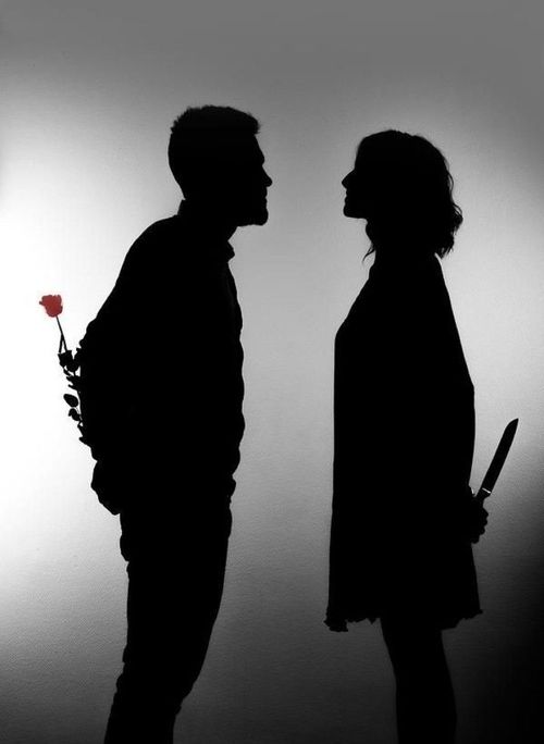 two people standing next to each other in silhouette