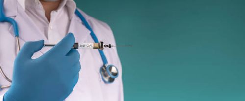 2019-ncov vaccine - doctor holding needle stock pictures, royalty-free photos & images