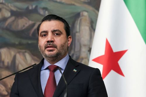 Syrian Foreign Minister Asaad al-Shaibani speaks to the press.