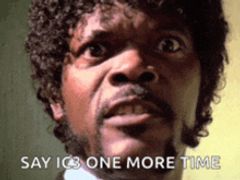 a close up of a man 's face with the words say ics one more time