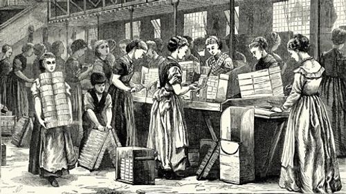 Women and children working in a match factory in London.