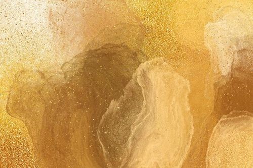abstract gold paint textured background with glitter
