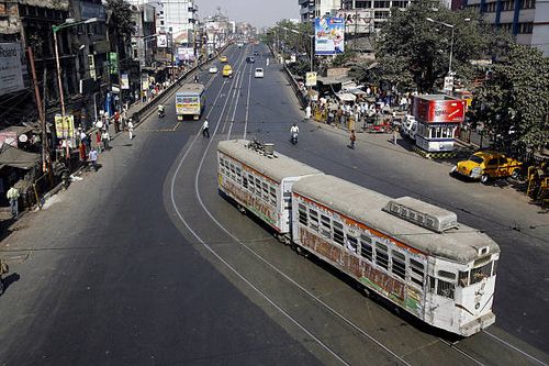 Tram rolls along a main road which is usually jammed with traffic, during a 12-hour general strike in Kolkata on January 22, 2009. Normal life was...