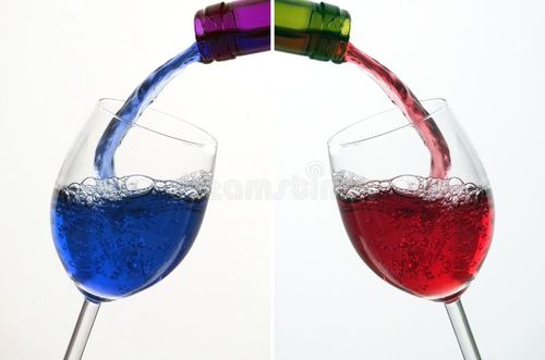 Two different Colour of Liquid in Wine Glass. Blue Coctail & Red Wine. Wine colour stock images, royalty-free photos and pictures