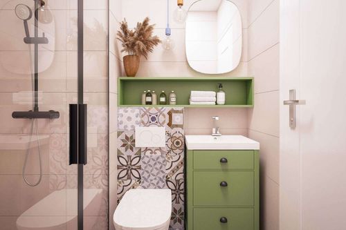 Modern small bathroom with green cabinet