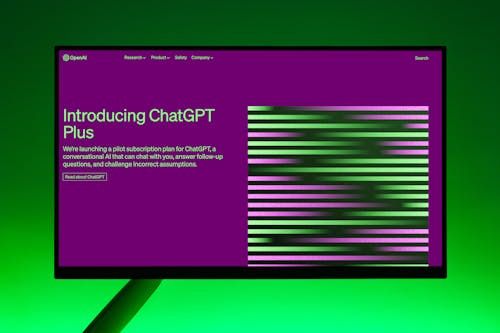 Free Close-up of a monitor displaying ChatGPT Plus introduction on a green background. Stock Photo