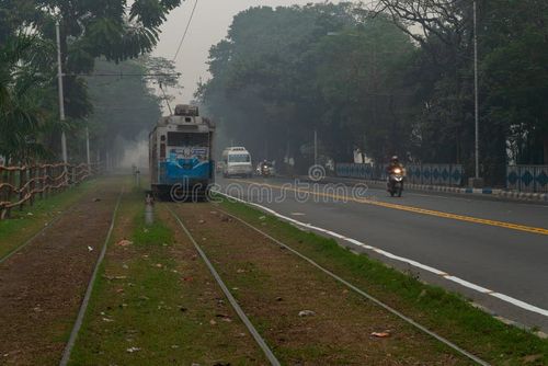 Kolkata, West Bengal, India - 23rd January 2020 : Electric Tram is passing through tram lines at Kolkata maidan area. It is the only tram system operating in India and oldest in Asia, 100 years old. Kolkata tram stock images, royalty-free photos and pictures
