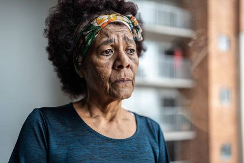 Sad senior woman contemplating at home Sad senior woman contemplating at home woman fear stock pictures, royalty-free photos & images