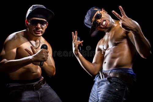 Rap concert with two muscular shirtless men with microphones