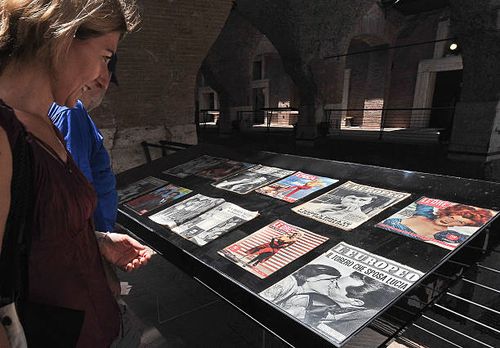 People look at magazine covers on display in the exhibition on "La Dolce Vita" , on August 3, 2010 at the ancient Mercati Traianei in Rome. The...