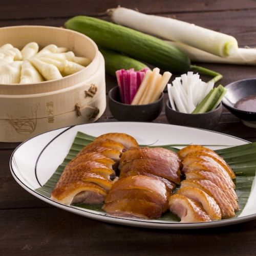 Crispy Hong Kong roast duck hanging in a shop window