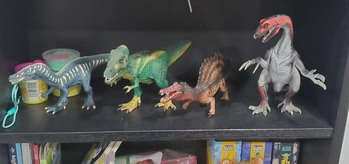 r/Dinosaurs - What types of dinoaurs are these? Were any of them herbivores? I know the T. Rex wasn't, but my friend's 3 yr old son said the red and grey one on the end was.