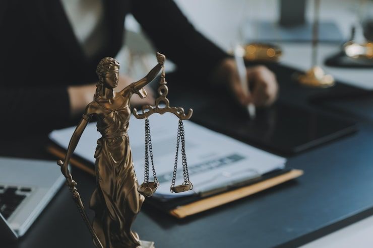 Legal books and balance scale representing justice