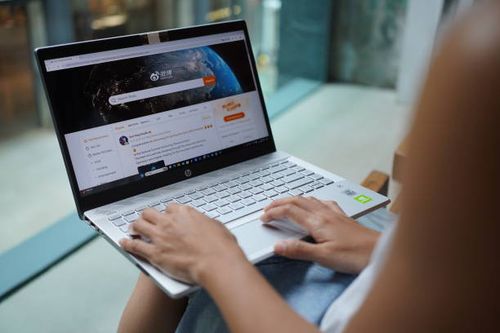 In this photo illustration, a woman browses Weibo website on her laptop.